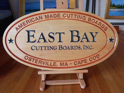 East Bay Cutting Boards logo on wood and in color