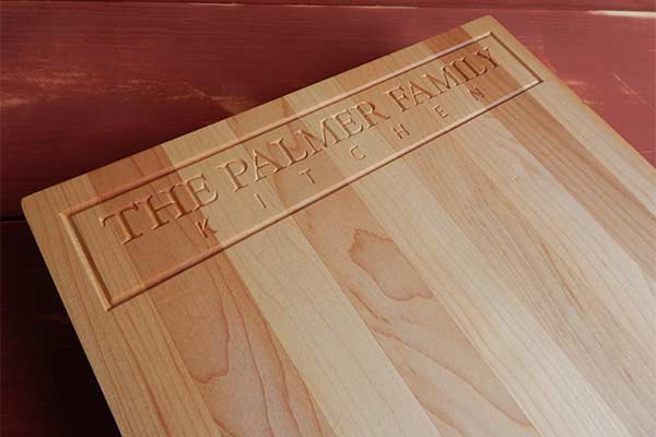 The Palmer Kitchen engraved on a personalized maple cutting board