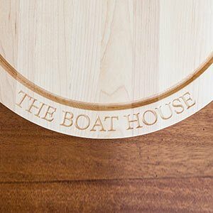 "Boat House" engraved on a round maple cutting board