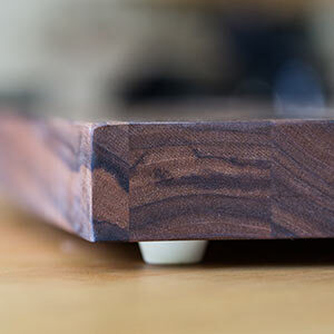 Detailed shot of a cutting board with thickness and rubber foot in focus